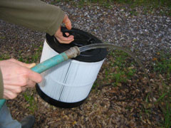 Use garden hose or shower to clean the dirt from the pleats. 